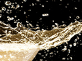 Detail of California Sparkling Wine splashing from glass